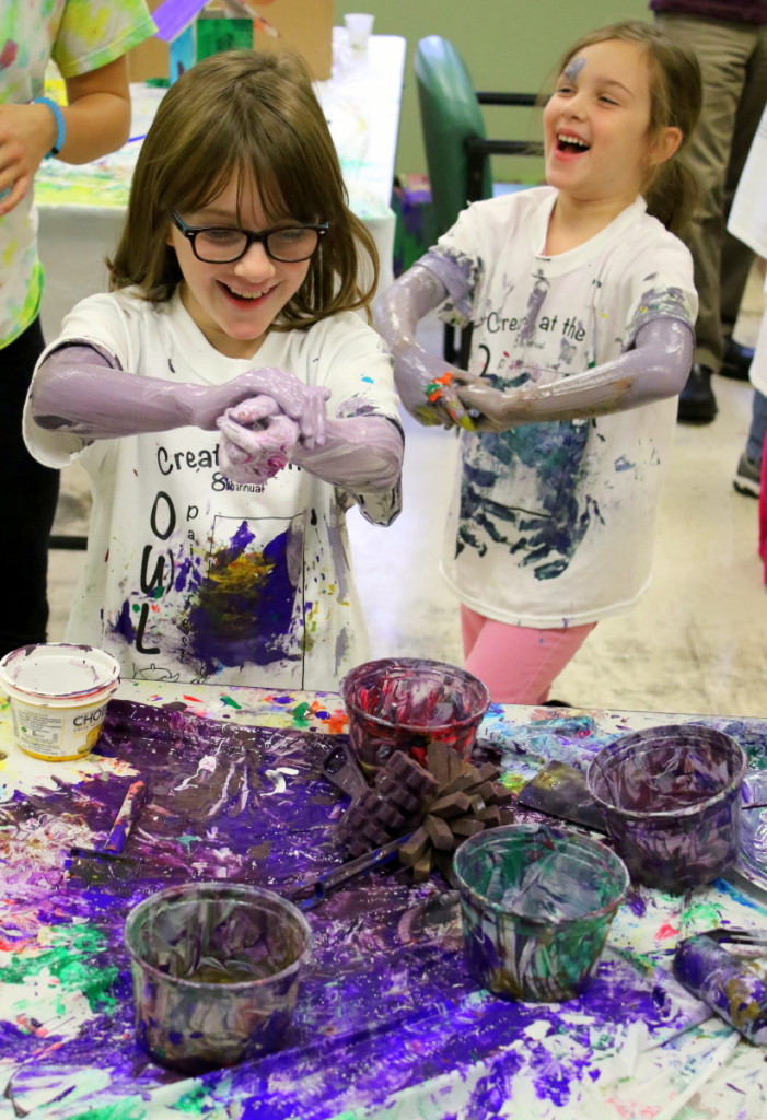 Sisters Elizabeth and Olivia Collins, Unadilla, got a little carried away and started painting themselves at OWL's 8th annual Paint Fest held this afternoon. The theme of this year's event was 'paint the town', and featured many community themed projects for children to experience from painting rocks, buildings and portraits. (Ian Austin/AllOTSEGO.com)